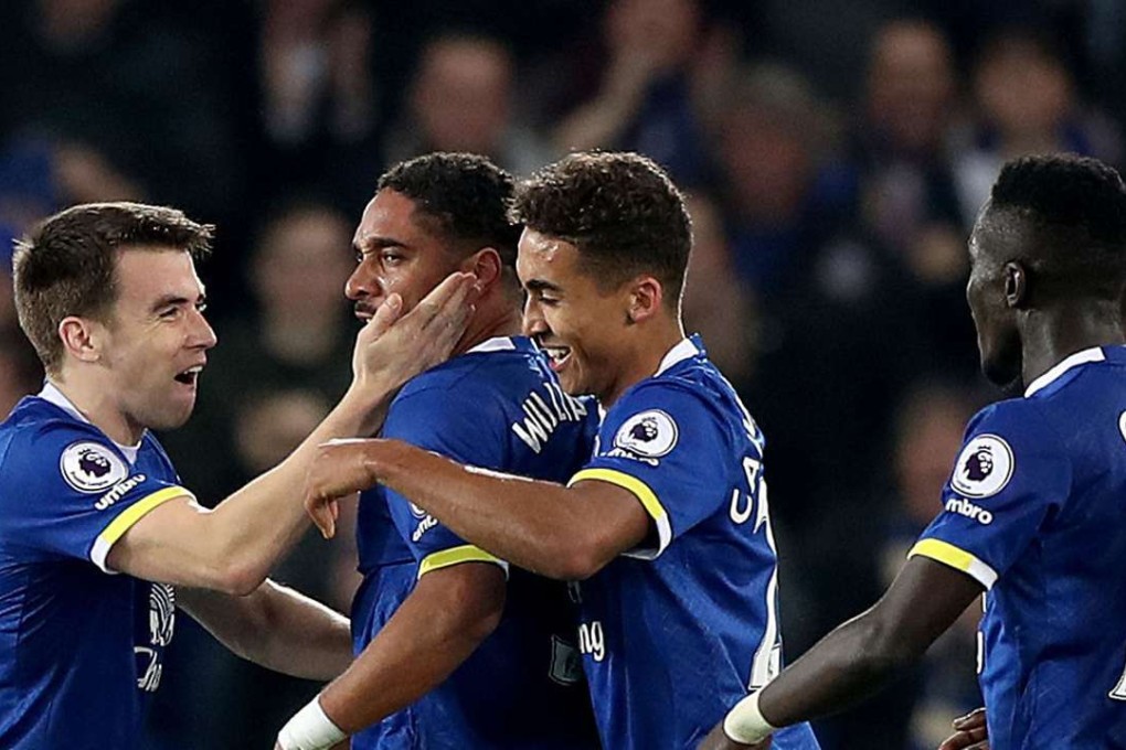 Everton's Ashley Williams, centre left, celebrates scoring his side's second goal. (Peter Byrne/PA via AP)