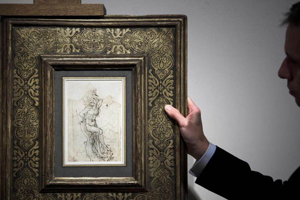 A member of Paris auctioneer Tajan displays a previously undiscovered drawing by Leonardo da Vinci at the auction house in Paris on Tuesday. Photo: AFP