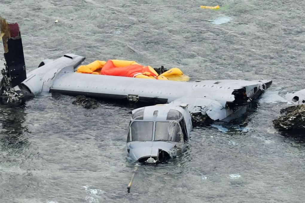 Wreckage of a US Marine Corps MV-22 Osprey aircraft lying in shallow waters off Nago. Photo: Kyodo
