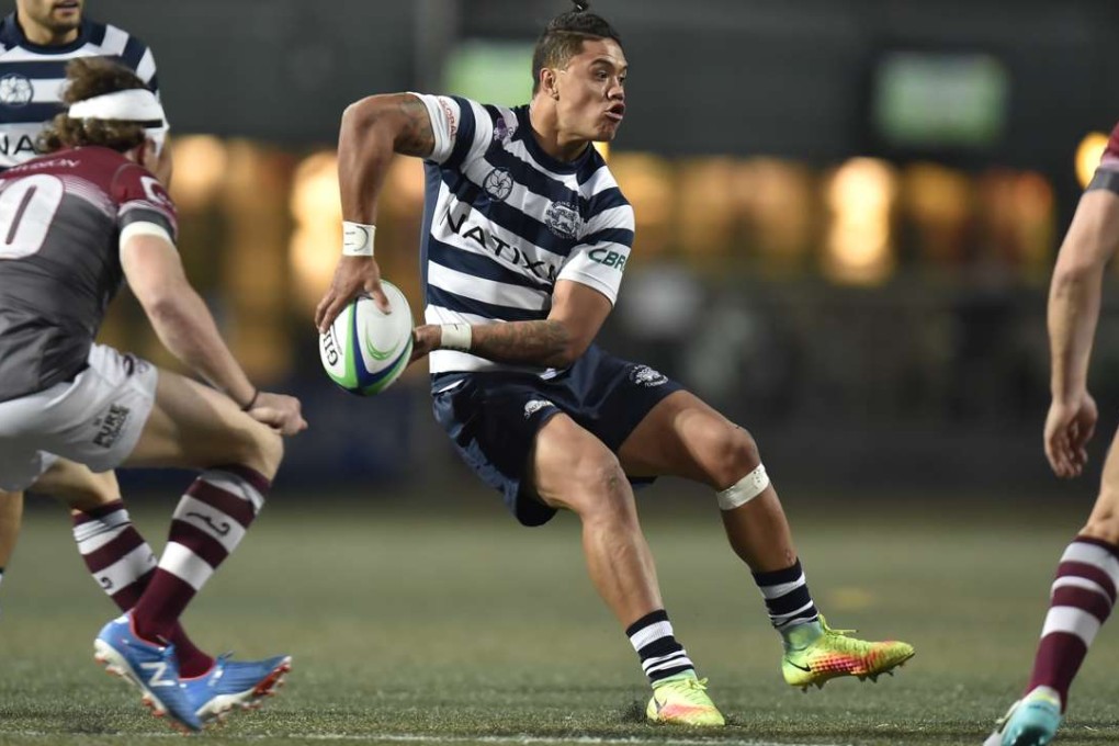 Nathan de Thierry swings a pass for HKFC in their win against Kowloon. Photos: Hong Kong Rugby Union