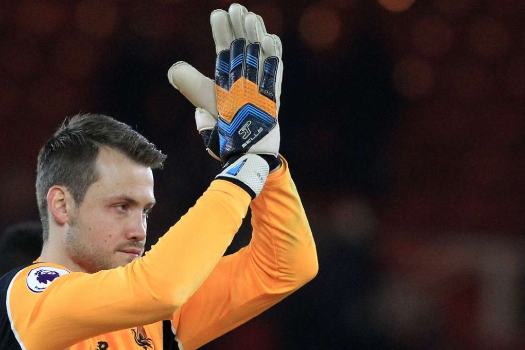 Liverpool's Belgian goalkeeper Simon Mignolet applauds the fans. AFP