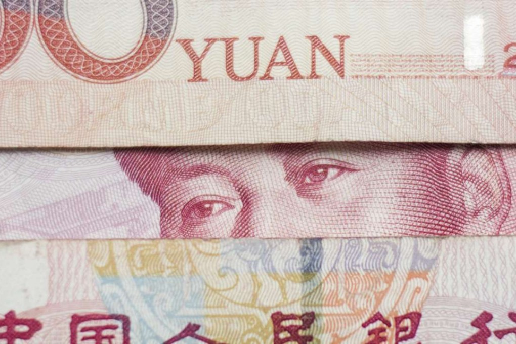 The People’s Bank of China slashed the yuan’s reference rate by 261 basis points to 6.9289 per US dollar. Photo: AFP