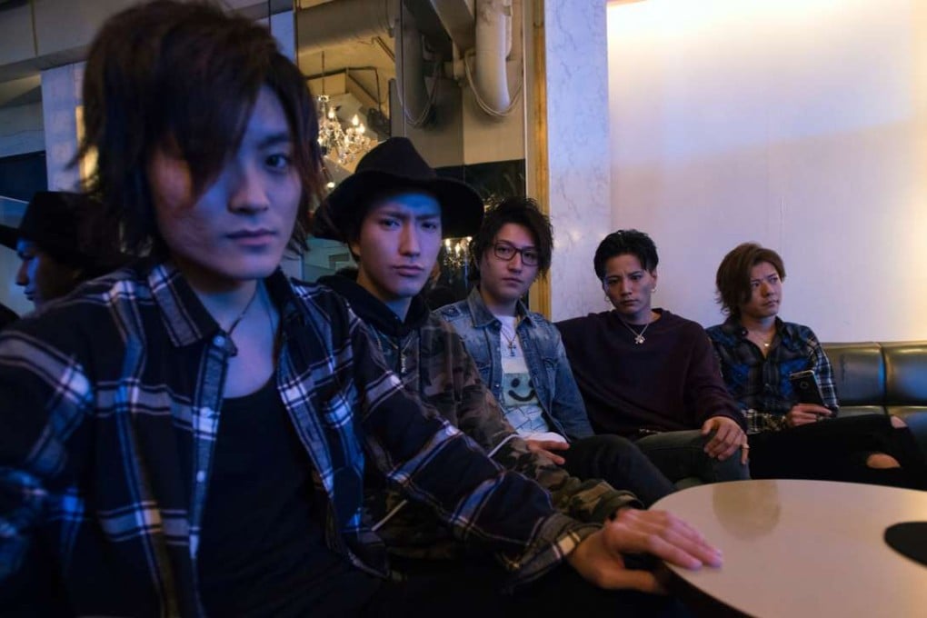 Hosts at the Shangrila club in Tokyo – which caters exclusively for women – sit with the club’s boss Ryohey Onizuka, second from right. Photo: Rob Gilhooly
