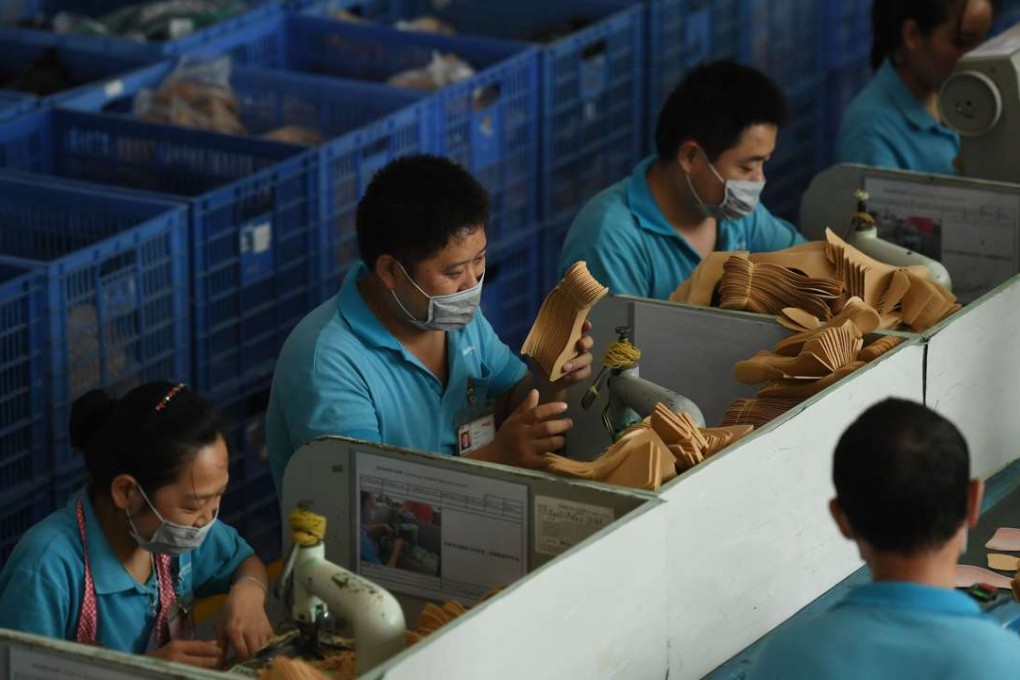 Workers on a production line at a shoe factory in Dongguan, Guangdong province, in September. With the huge supply of cheap labour now petering out, the focus is on innovation and increased productivity. Photo: AFP