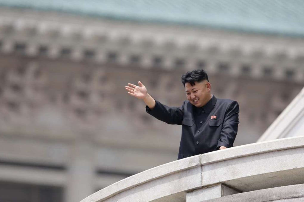 North Korean leader Kim Jong-un waves to the people during a parade to commemorate the 60th anniversary of the signing of a truce in the 1950-1953 Korean war, at Kim Il-sung Square in Pyongyang on July 27, 2013. Photo: Reuters