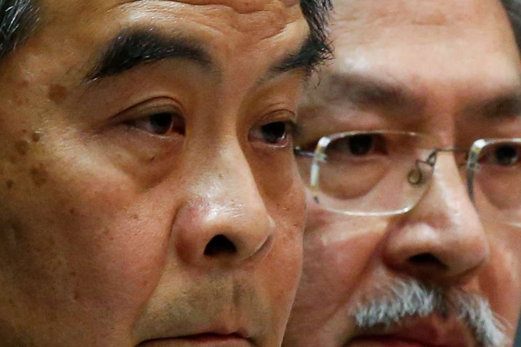 Some Hongkongers are jubilant at the imminent exit of Chief Executive Leung Chun-ying, and speculating whether John Tsang’s presidential handshakes are signs of a green light. Photo: Reuters