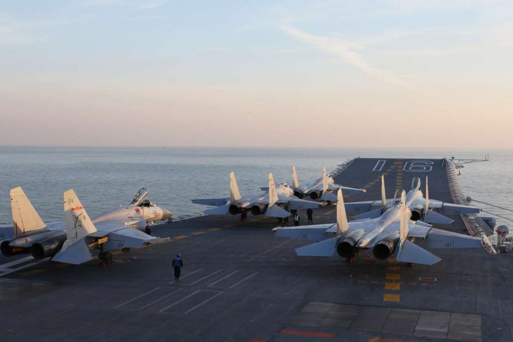 Two J-15 fighters about to launch from the desk of the Liaoning during the drill. Photo: AFP