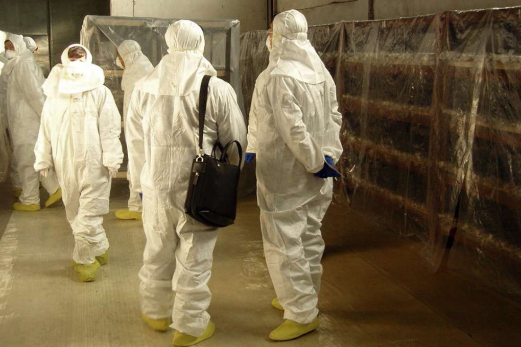 South Korean officials inspect unused fuel rods at a warehouse at North Korea’s nuclear complex in Yongbyon. A South Korean team had discussed buying the rods as part of a six-nation nuclear deal to dismantle the communist state’s main nuclear site. Photo: AFP