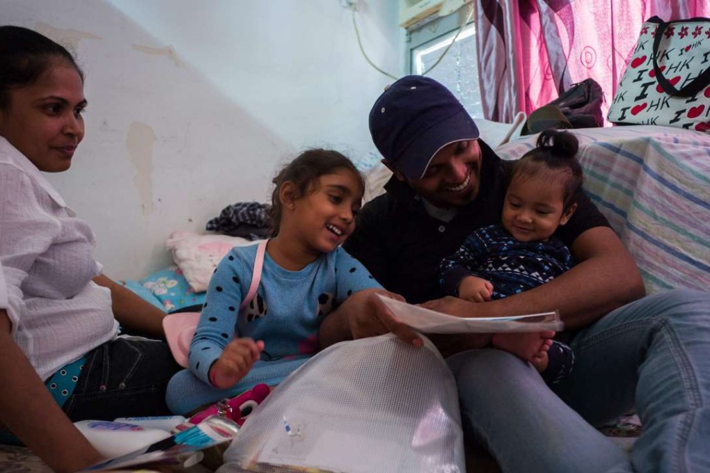 Nadeeka Dilrukshi Nonis (left) and partner Supun Thilina Kellapatha with their children. Photo: AFP