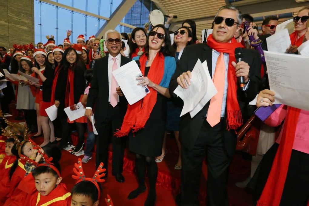 Morgan Stanley staff members belt out their greatest Christmas hits in a fundraising finale marked by healthy competition and good cheer. Photo: Dickson Lee