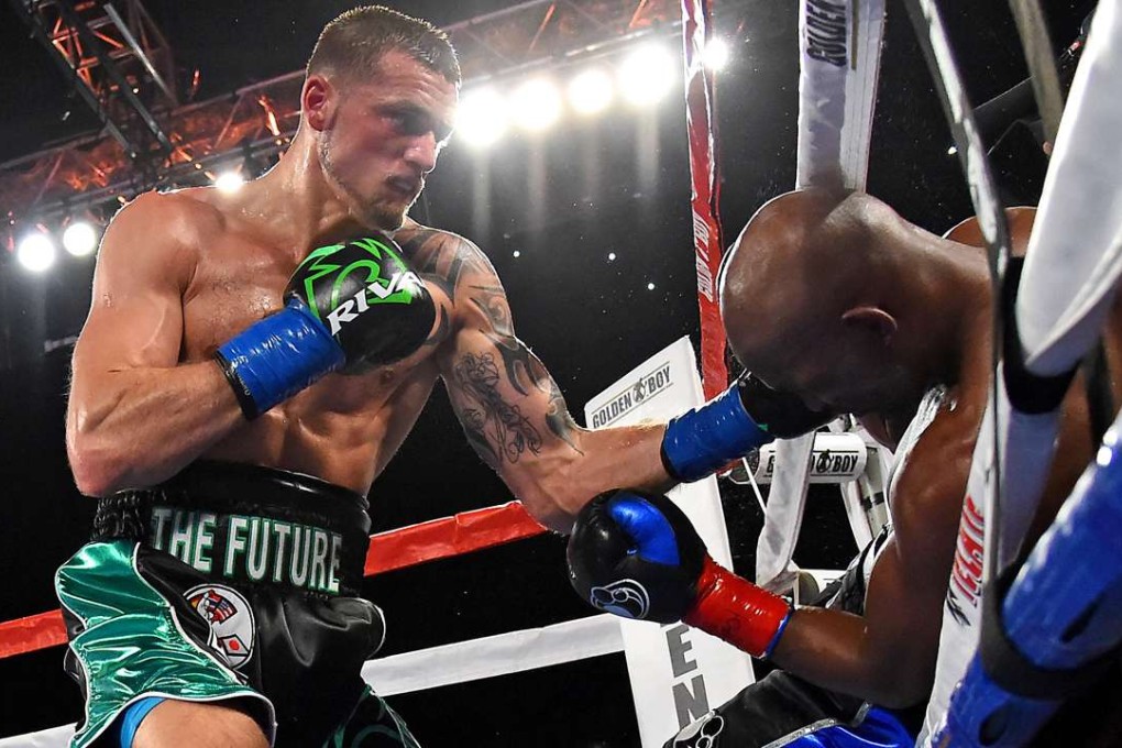 Bernard Hopkins is knocked out of the ring by Joe Smith. Photo: USA Today Sports
