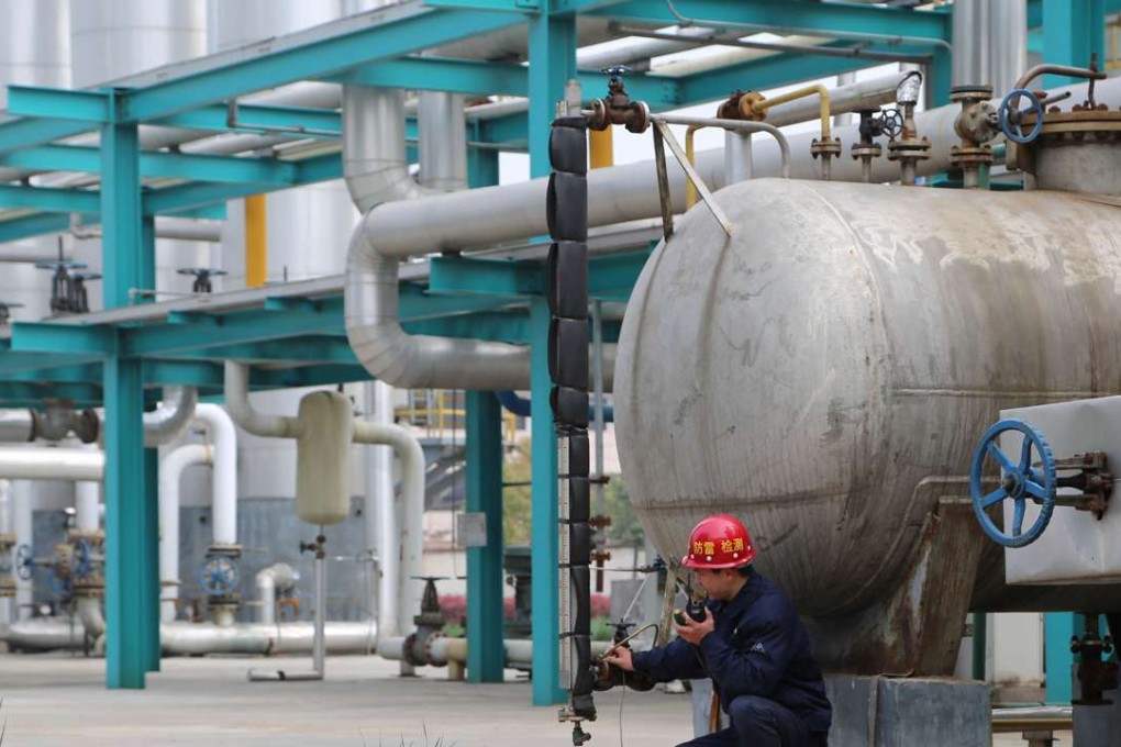 An employee works inside a factory owned by Pingmei Shenma Group in Baofeng county, Henan province. The state-owned enterprise provides many social functions for its employees. Photo: Reuters