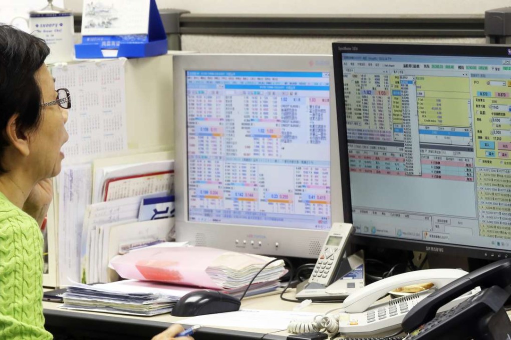 Many Hong Kong firms are expanding their research teams to conduct A-share research and to offer other stock market-related services to boost cross border trading. Photo: Dickson Lee