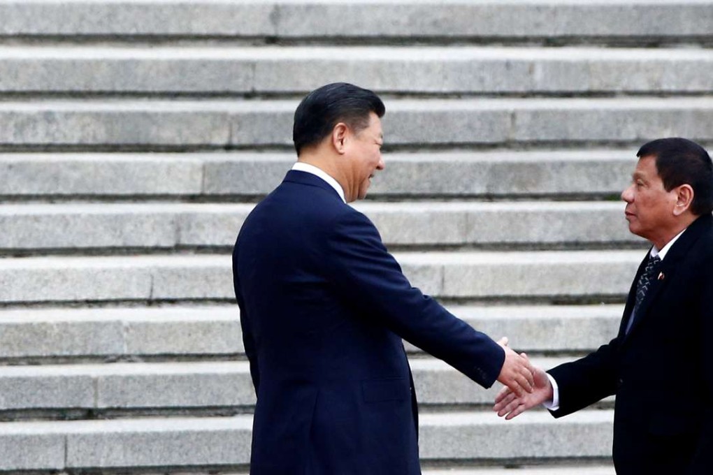 Philippines President Rodrigo Duterte and Chinese President Xi Jinping shake hands. Photo: Reuters
