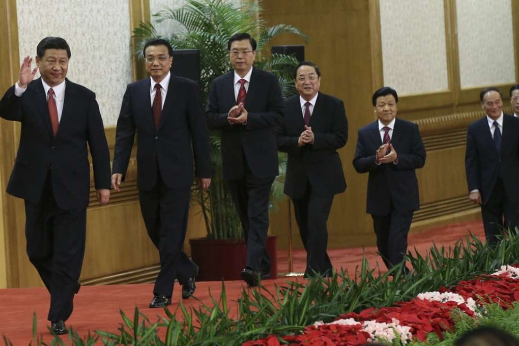 The members of the new Politburo Standing Committee (from left) Xi Jinping, Li Keqiang, Zhang Dejiang, Yu Zhengsheng, Liu Yunshan, Wang Qishan and Zhang Gaoli step onto the stage in the Great Hall of the People in Beijing in November 2012. Photo: Reuters