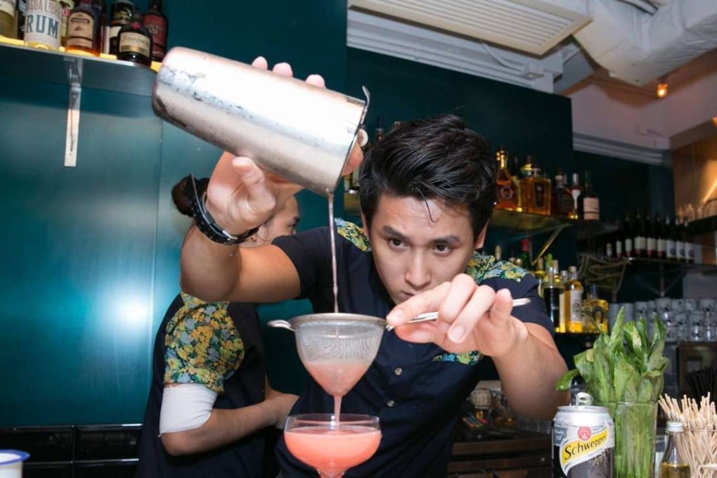 A bartender mixes drinks at Rummin' Tings on Hollywood Road in Central.