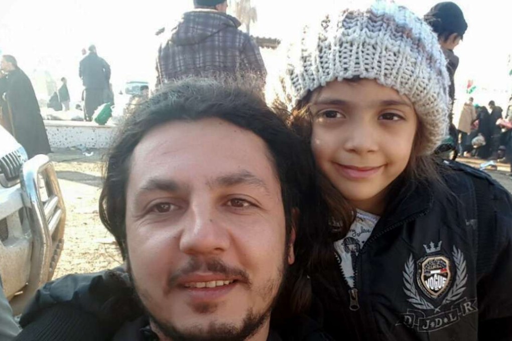 A handout picture taken and released by Turkish NGO Humanitarian Relief Foundation on Monday shows a worker of the NGO, Burak Karacaogl, in a selfie picture with seven-year-old Bana Alabed at Rashidin district in Syria after she was evacuated from the divided Syrian city of Aleppo. Photo: AFP