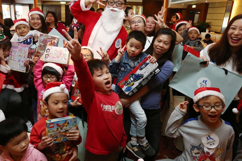 Children and volunteers have a blast at an on-board Christmas party in floating seafood restaurant Jumbo Kingdom. Photo: Jonathan Wong