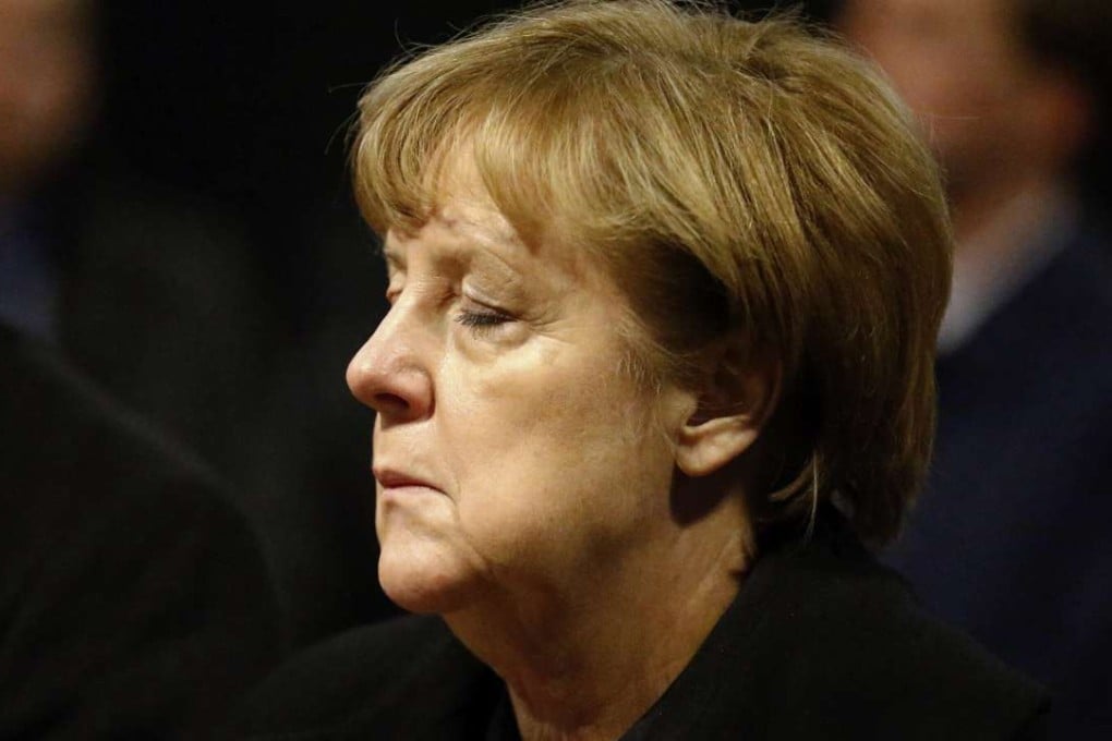 German Chancellor Angela Merkel arrives to sign the condolence book at the Memorial Church in Berlin on Tuesday, one day after a truck ploughed into a crowded Christmas market in the German capital killing 12 people. Photo: AP