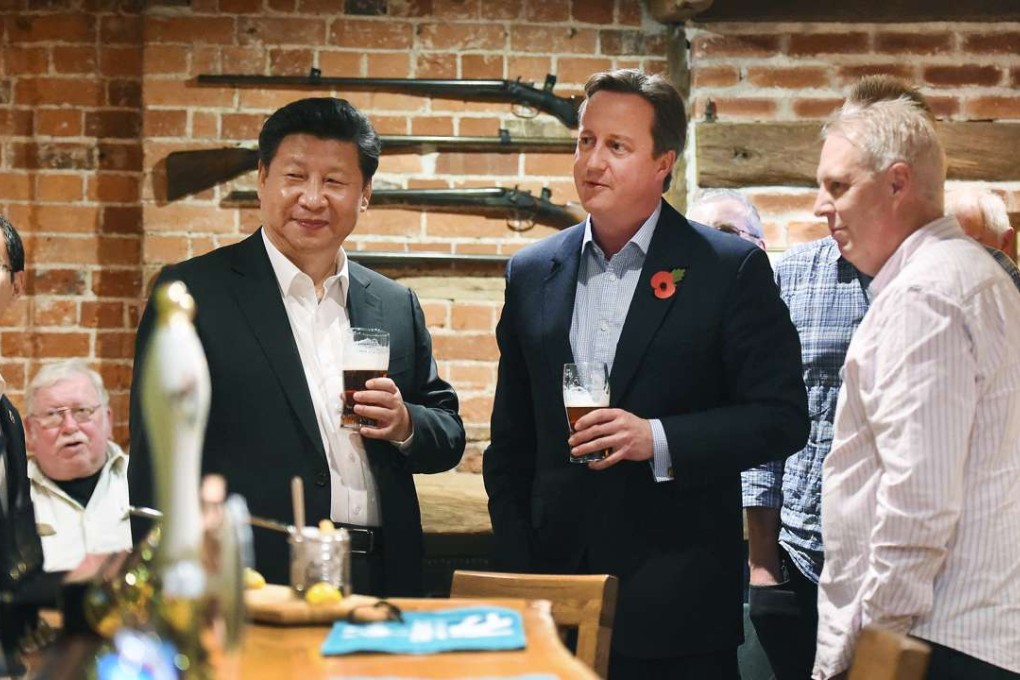 President Xi Jinping and then British prime minister David Cameron enjoy a pint at a country pub during Xi’s state visit to the UK in October, 2015. Photo: AFP