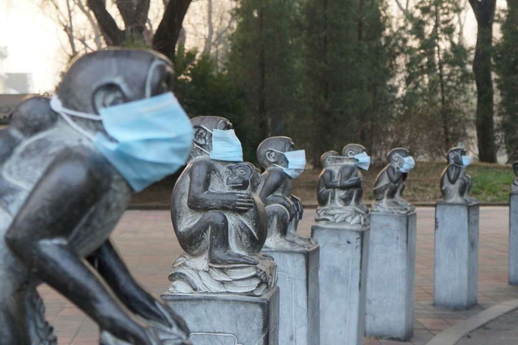 Face masks on monkey statues at Beijing Zoo in protest against heavy air pollution in the capital. Heavy smog suffocated northeast China again on Tuesday, with hundreds of flights cancelled. Photo: AFP