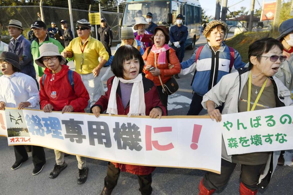People stage a rally against the construction of a helipad near the US military's Northern Training Area in the village of Higashi. Photo: Kyodo