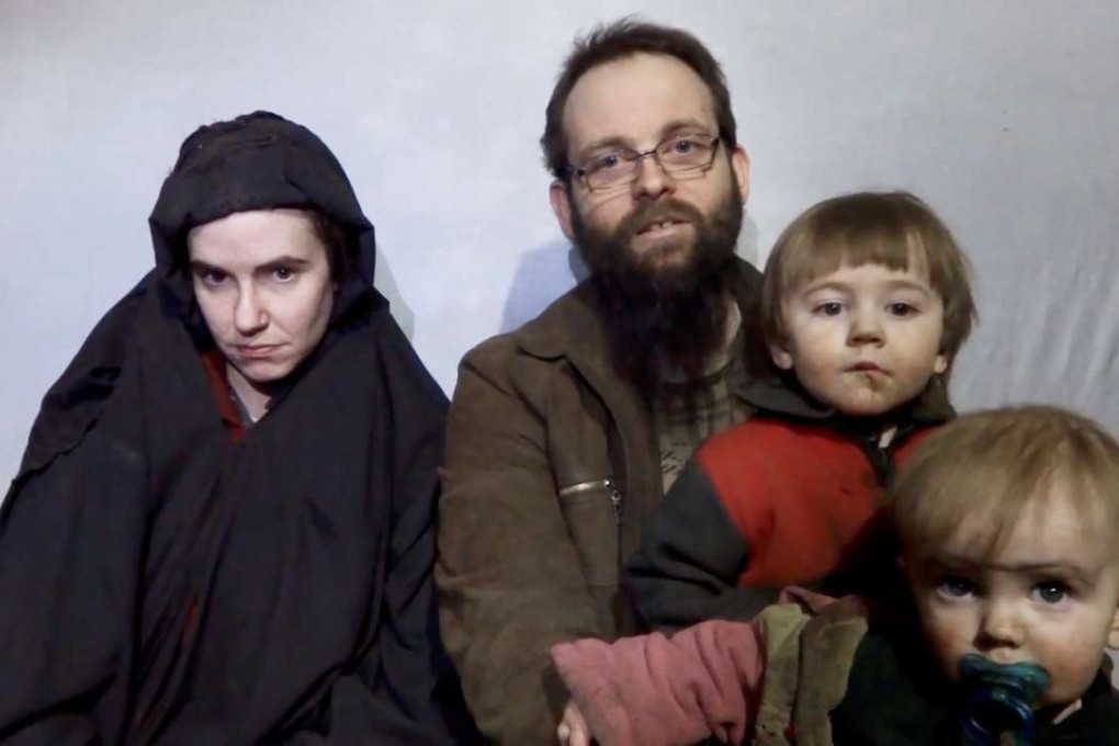 A still image from a video posted by the Taliban on social media on December 19 shows American Caitlan Coleman next to her Canadian husband Joshua Boyle and their two sons. Photo: Reuters