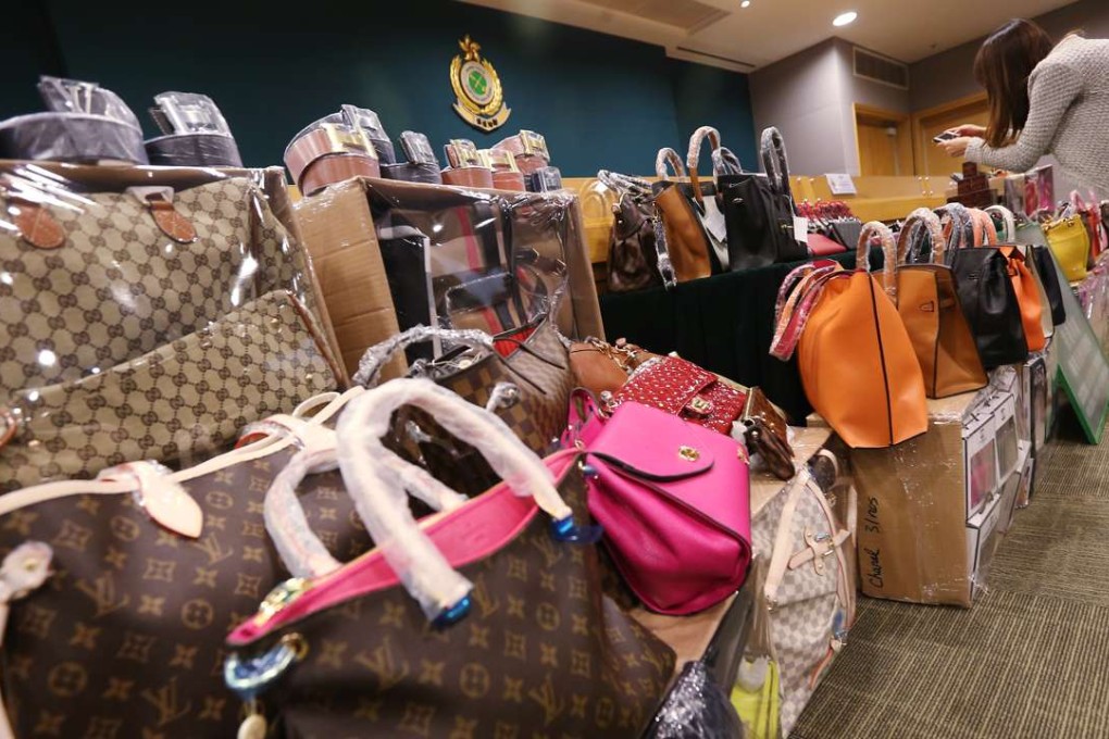 Counterfeit handbags are displayed by customs authorities in Hong Kong in 2014. US resident Praepitcha Smatsorabudh sourced fake bags from Hong Kong and China carry out her scam. Photo: SCMP