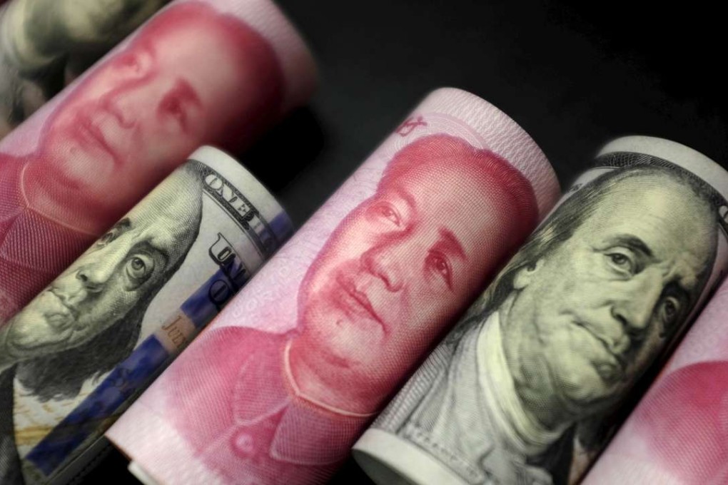 The yuan has fallen steadily against the greenback to hit an eight-year low, and is expected to soon break the barrier of 7 yuan to the dollar. Photo: Reuters
