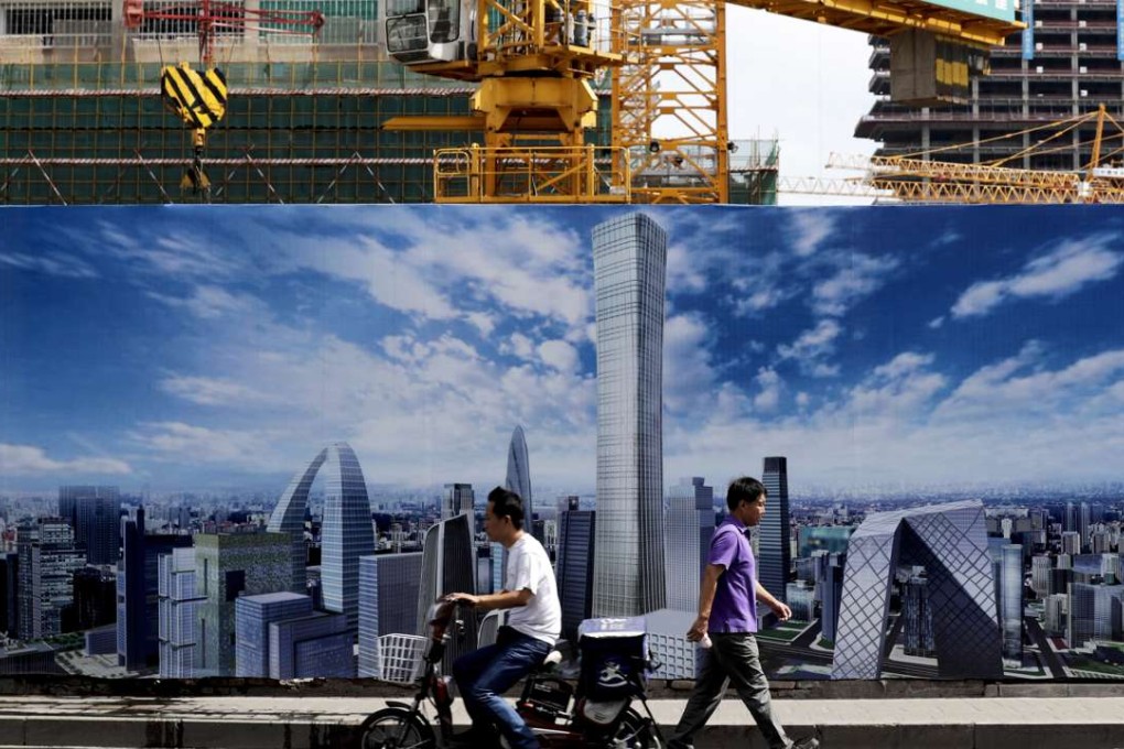 A construction site wall depicts the Beijing skyline. Photo: AP