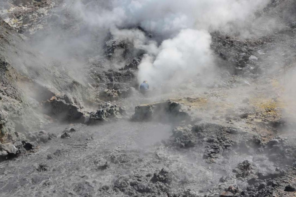 A photo taken on June 6, 2013 shows fumaroles and mud pools of the Campi Flegrei caldera, a supervolcano, near Naples. The slumbering volcano shows signs of reawakening. Photo: AFP
