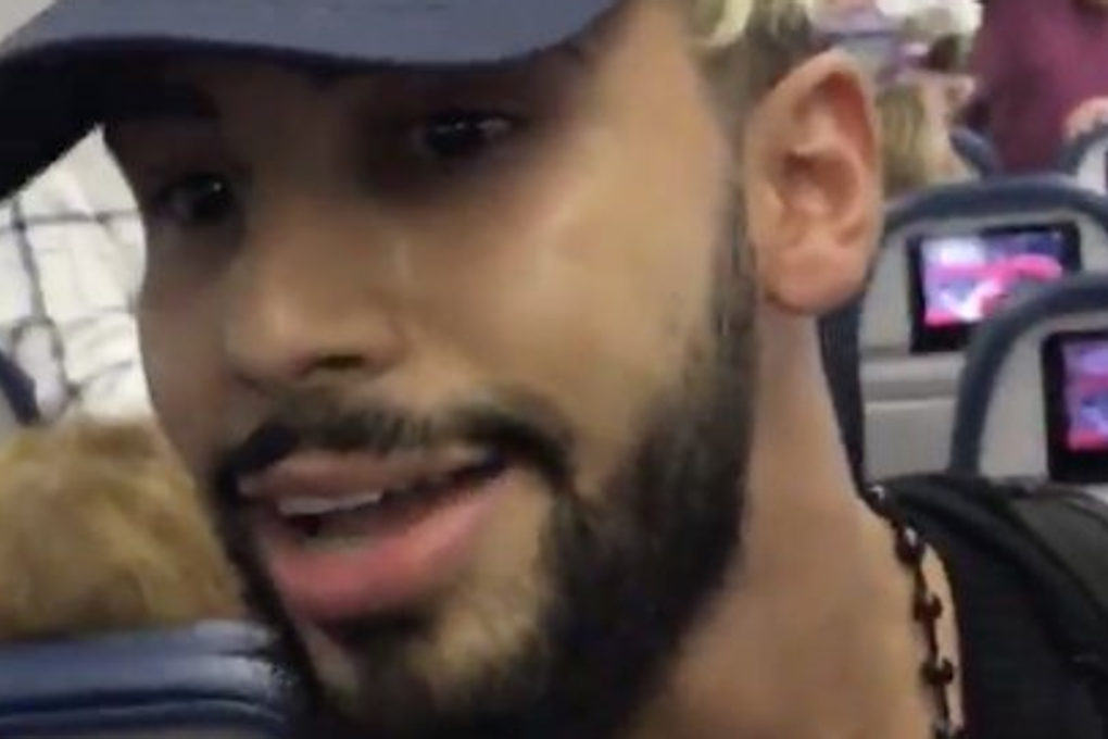 Screenshot of a video taken by Adam Saleh shows him being removed from a Delta flight. Photo: Twitter/Adam Saleh