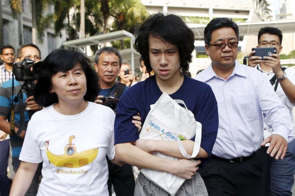 Teen blogger Amos Yee leaves court with his parents after his sentencing in Singapore last year. Photo: Reuters