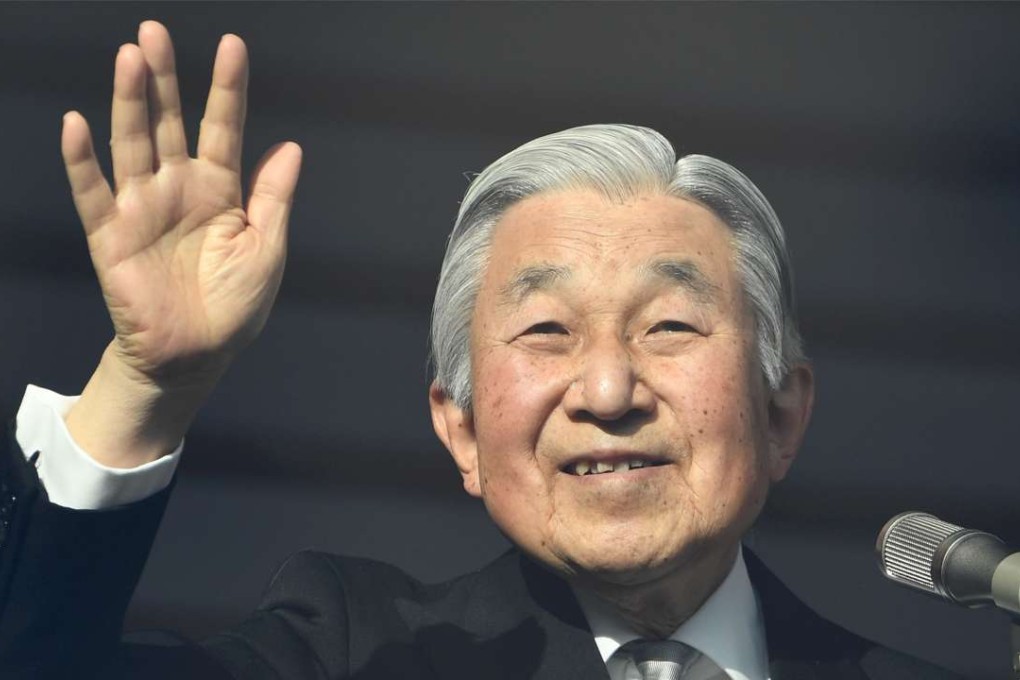 Japanese Emperor Akihito waves to well-wishers as he makes a public appearance on the balcony of the Imperial Palace in Tokyo. Photo: AFP