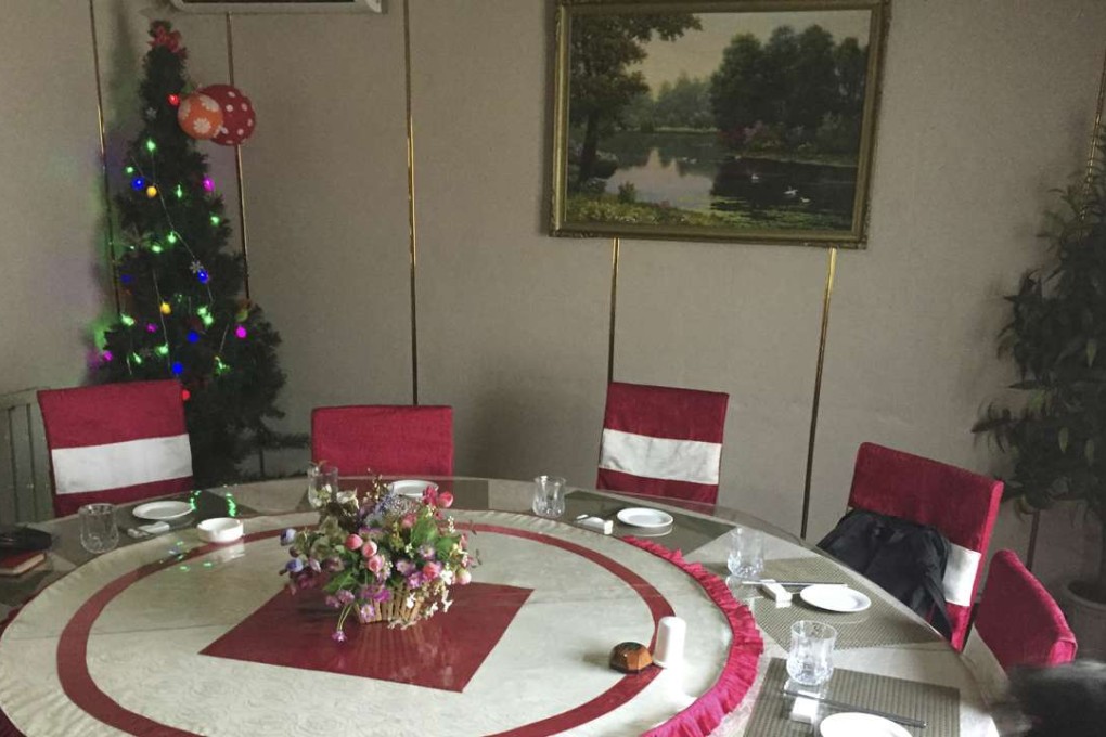 A Christmas tree in the corner of a restaurant in Pyongyang, North Korea. Photo: AP