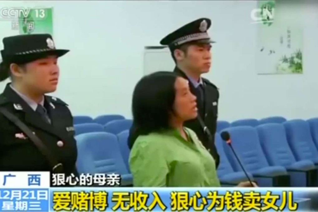 The mother detained by police. Photo: CCTV