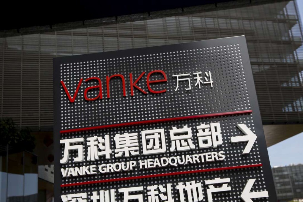Signs show the direction of Vanke group headquarters and Shenzhen Vanke Real Estate at its headquarters in Shenzhen. Photo: REUTERS