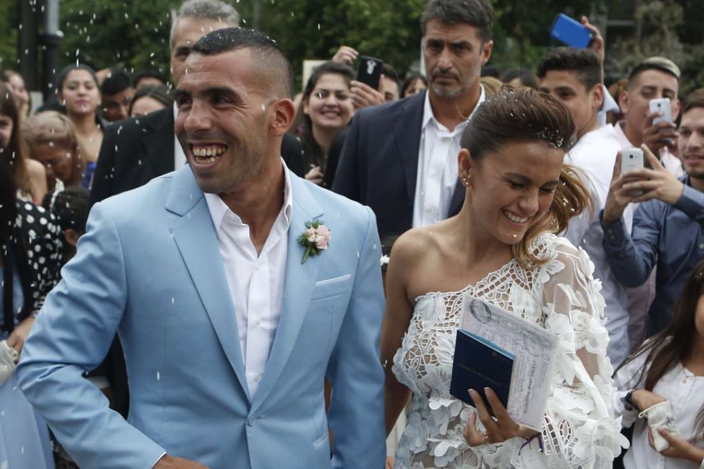 Carlos Tevez and his wife Vanesa Mansilla exit the church after their wedding in Buenos Aires. Photo: AP