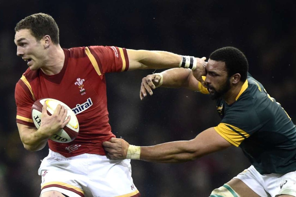 Wales' George North (left) is tackled by South Africa's Uzair Cassiem in November. Photo: Reuters