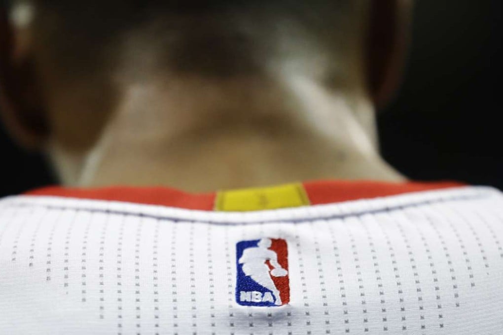 An NBA logo is displayed on the back of a player's jersey. Photo: AP