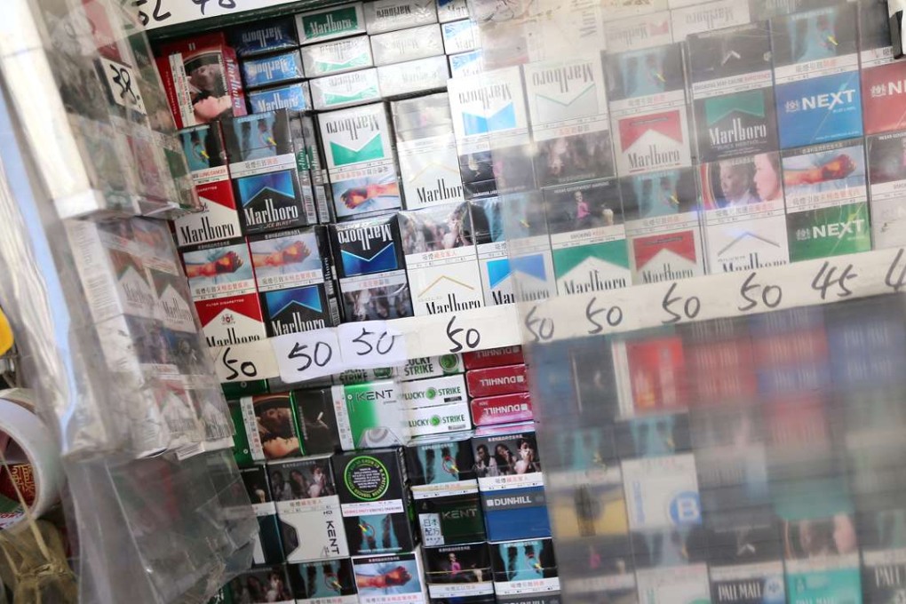 Packs of cigarettes are displayed on a stall in Mong Kok. Hong Kong plans to reform cigarette packaging in an attempt to deter smoking. Photo: David Wong