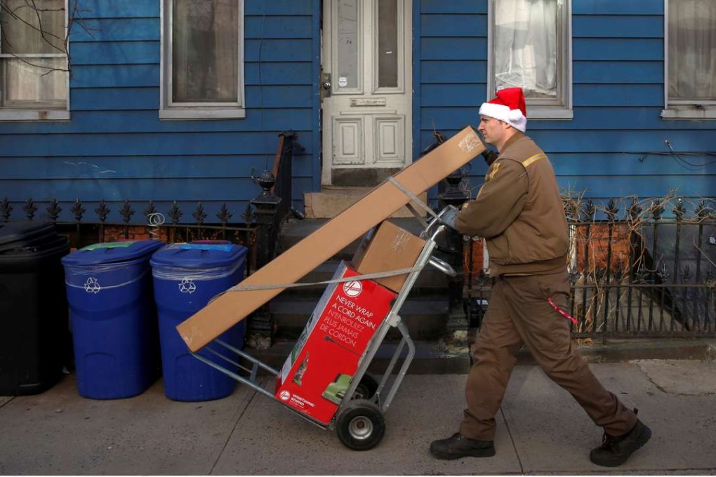A worker delivering packages in Brooklyn, New York City. Photo: Reuters