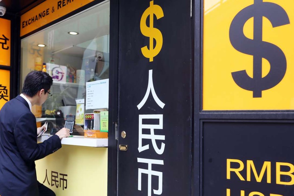 A man is seen at a currency exchange store in Hong Kong. Photo: Sam Tsang