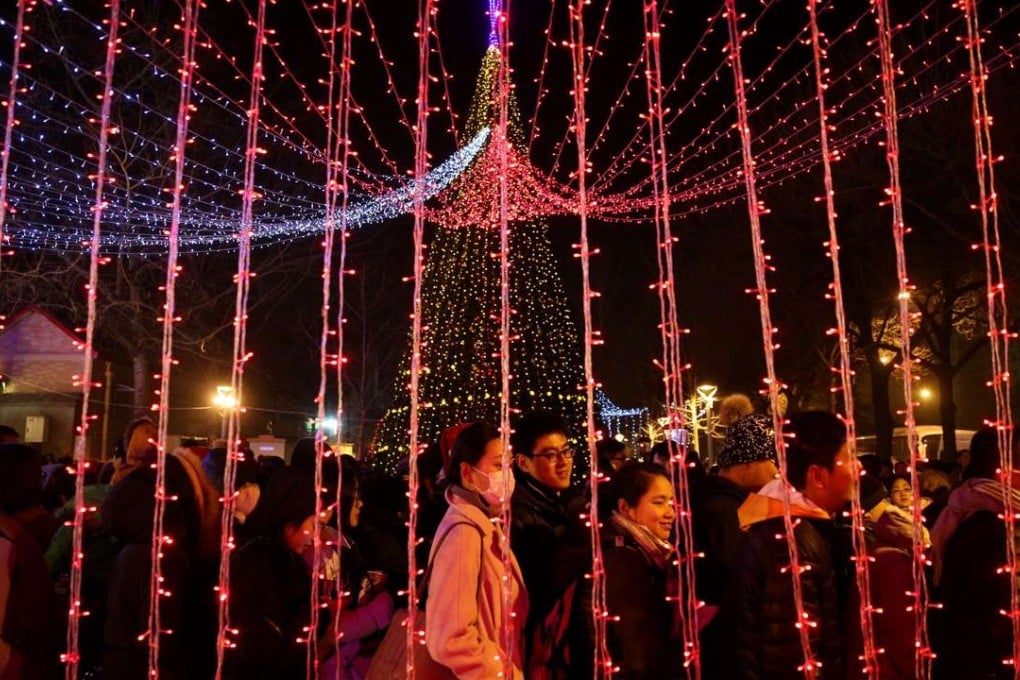 Catholics queue up to enter the state-approved Xuanwumen Catholic Church, otherwise known as the South Cathedral in Beijing, on Christmas Eve. Photo: EPA