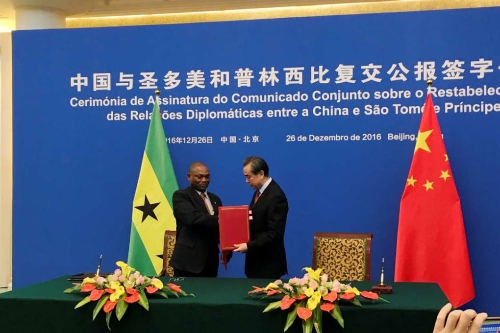 China's Foreign Minister Wang Yi (right) and Sao Tome and Principe's Foreign Minister Urbino Botelho attend a signing ceremony to establish diplomatic relations. Photo: Reuters