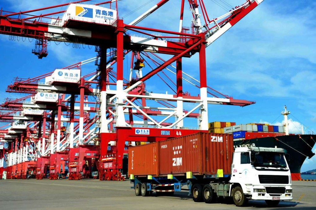 A truck transports containers at a port in Qingdao, Shandong province. China’s logistics industry is valued at 10 trillion yuan, but Beijing is determined to downsize the business to avoid duplication and waste of transportation resources. Photo: AFP