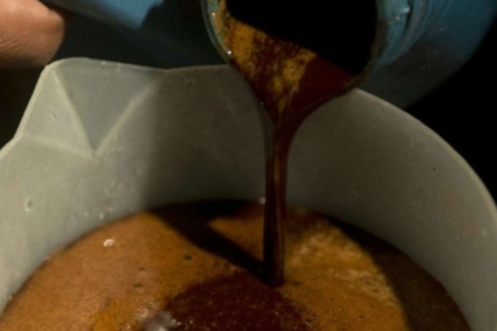 A healer prepares a mixture of the Ayahuasca hallucinogenic liana and a psychoactive bush during a traditional indigenous ritual in Colombia. File photo: EPA