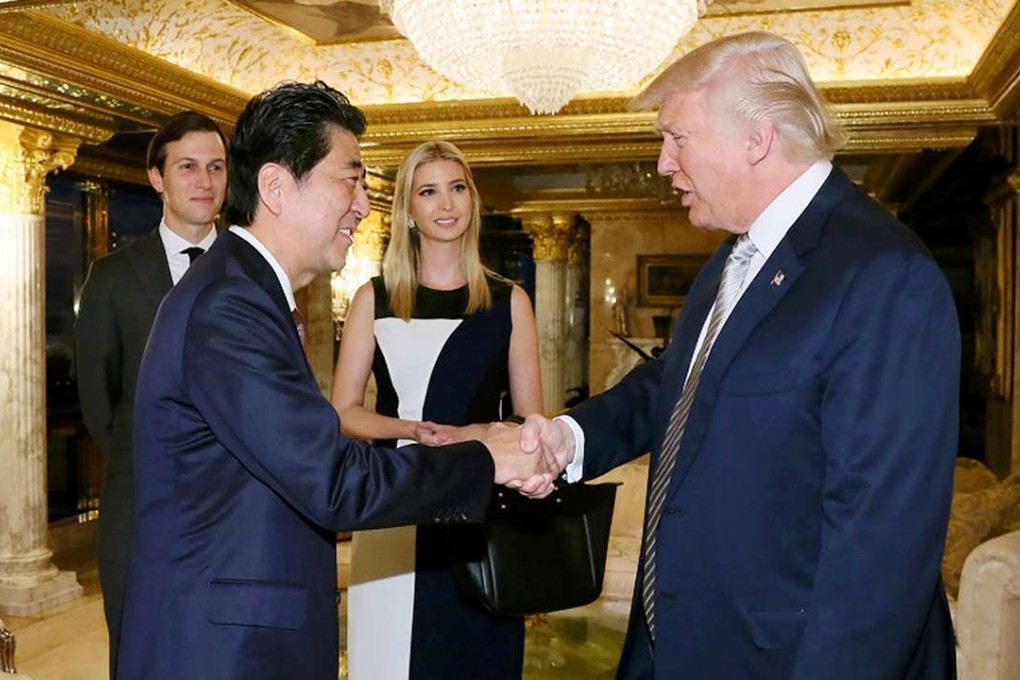 US President-elect Donald Trump (right) greets Japan’s Prime Minister Shinzo Abe in New York, Trump’s first meeting with a world leader following his election. Trump’s daughter Ivanka and her husband Jared Kushner look on. Photo: Japan Cabinet Secretariat, AFP