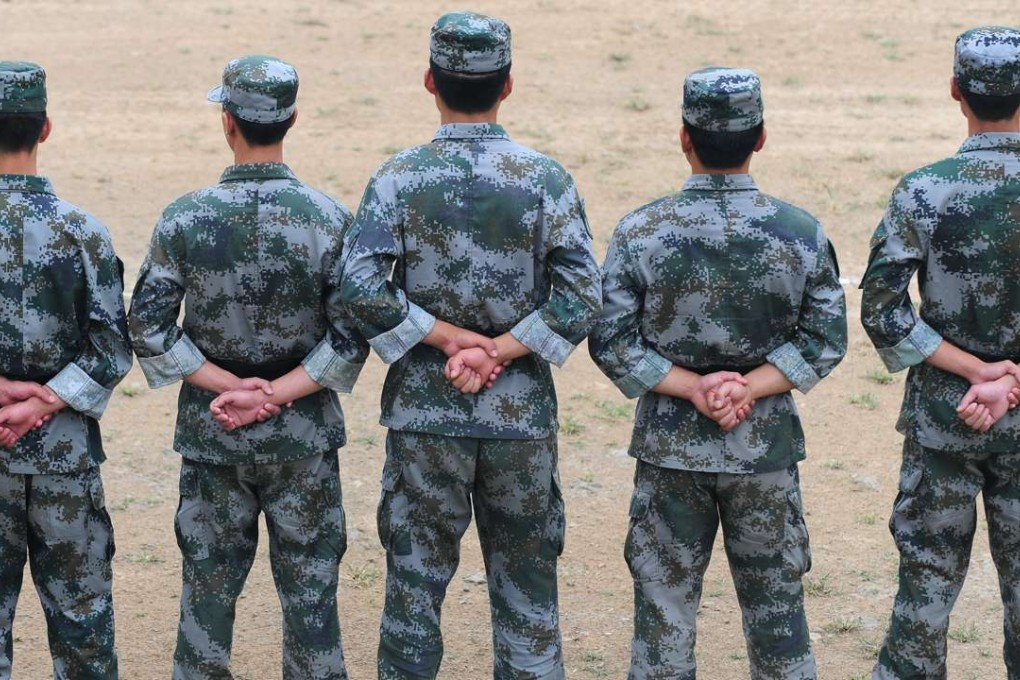 A file picture of PLA troops on parade at a base in Beijing. The soldiers warned over the use of fitness apps serve in Fujian province. Photo: AFP