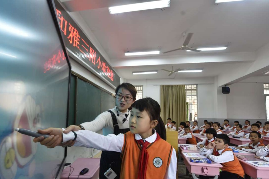 Teacher Zhang Mingchan gives a mathematics lesson with the help of a cloud-based teaching platform at a primary school in Fuzhou, Fujian province, in November. Photo: Xinhua